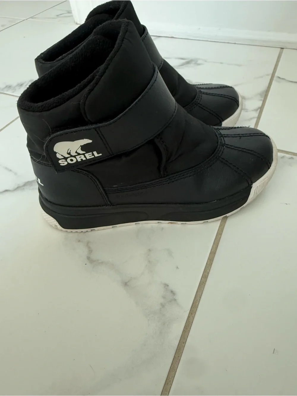 Sorel Kids Black Slip-On Winter Boots with White Sole